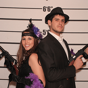St Louis Murder Mystery party guests pose for mugshots