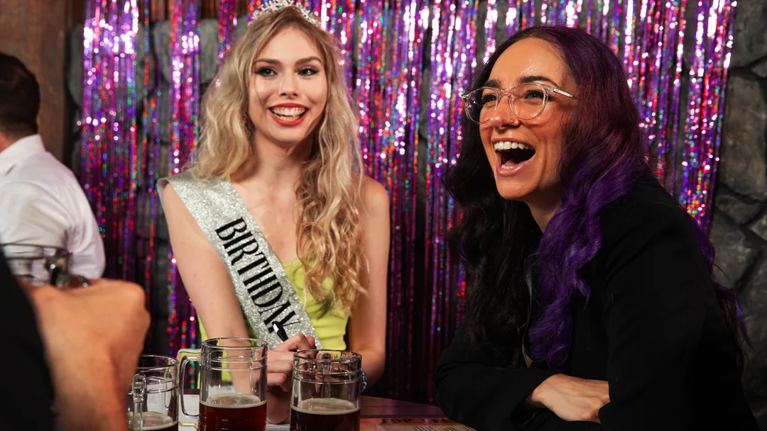 Guests celebrating at a St. Louis murder mystery party